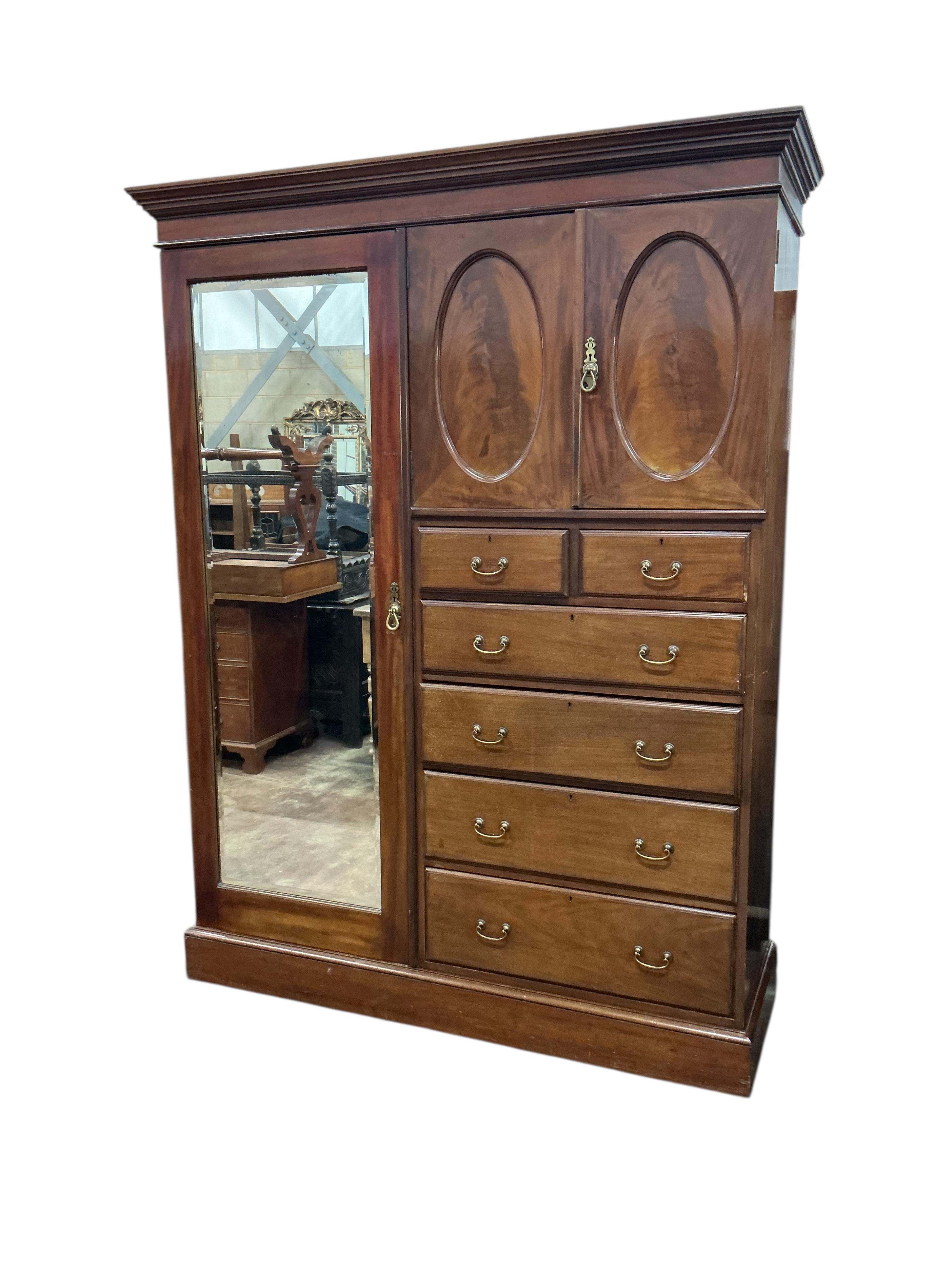 An early 20th century mahogany mirrored compactum wardrobe, width 154cm, depth 50cm, height 208cm